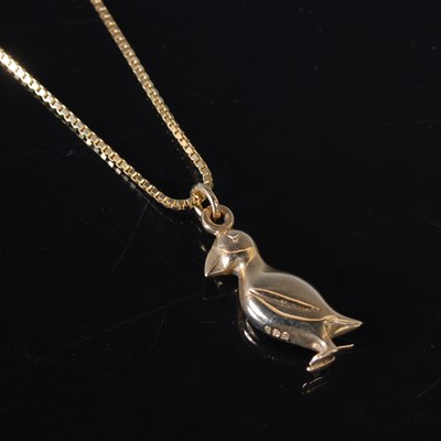 Lot 135 - A 14ct gold necklace suspending a 14ct gold...