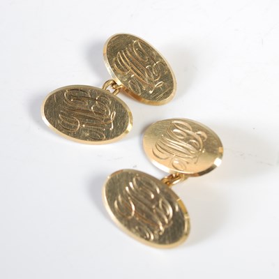 Lot 195 - A pair of 18ct gold oval cufflinks, engraved...