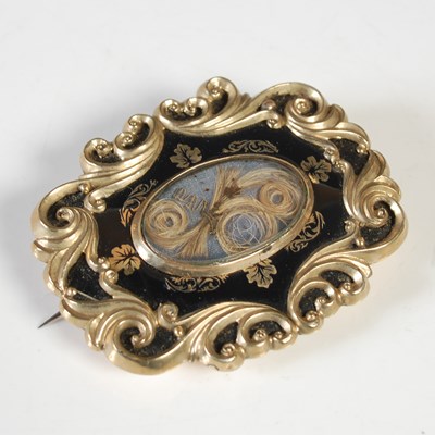 Lot 196 - A 19th century yellow metal and black enamel...