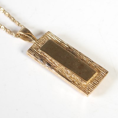 Lot 155 - A 9ct gold necklace suspending a 9ct gold...