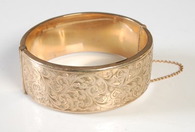 Lot 162 - A 9ct gold hinged bangle, 29.7g.