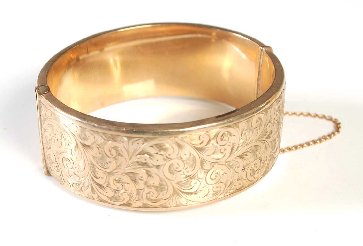 Lot 156 - A 9ct gold hinged bangle, 29.7g.