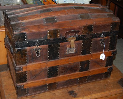 Lot 708 - A wood and metal bound dome top trunk
