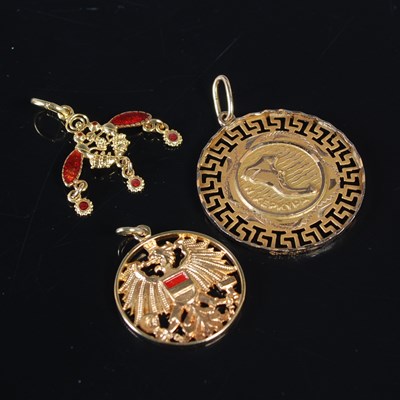 Lot 164 - Three gold pendants, to include a yellow metal...