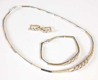 Lot 167 - A two colour gold and diamond set suite of...