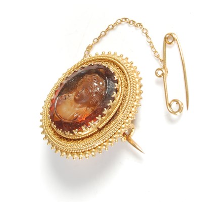 Lot 174 - A gold gem set intaglio carved brooch, carved...