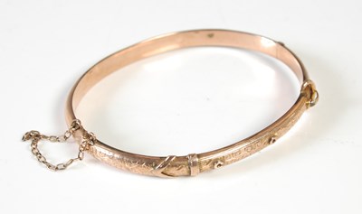 Lot 185 - A 9ct gold hinged bangle, 6.9g.