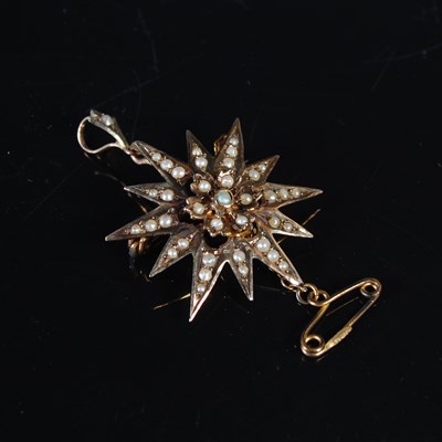 Lot 202 - A 9ct gold and split pearl star shaped pendant...
