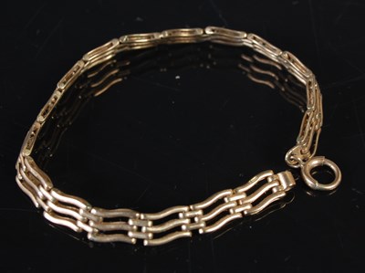 Lot 203 - A yellow metal gate link bracelet, stamped '9k'...