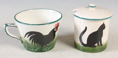 Lot 228 - A Wemyss Pottery teacup decorated with two...