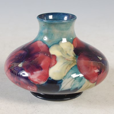 Lot 232 - A small Moorcroft Pottery vase decorated with...