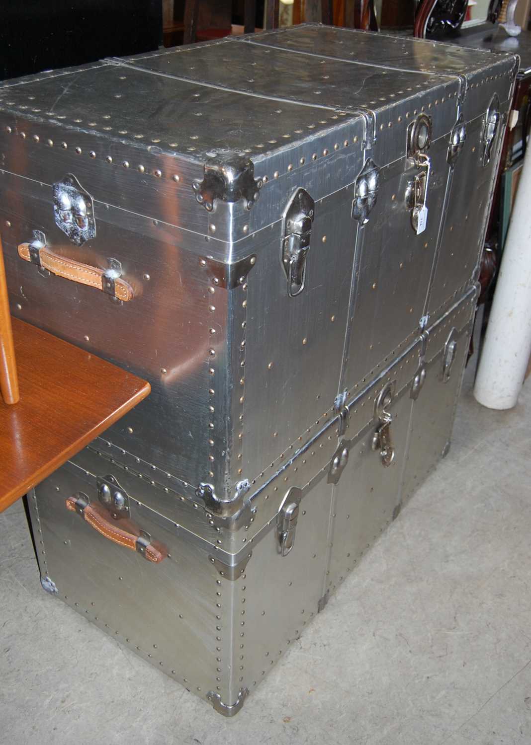 Lot 714 - A pair of polished alloy steamer trunks