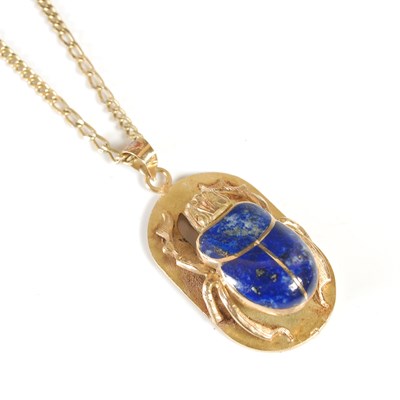 Lot 244 - A gold and lapis lazuli pendant necklace, the...