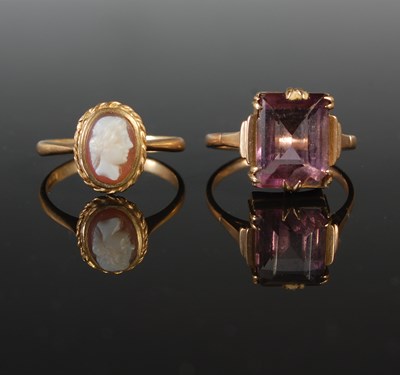 Lot 266 - Two yellow metal rings, one set with oval...