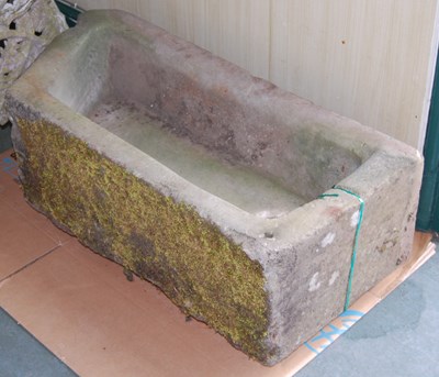 Lot 718 - A stone trough / planter with circular bore...