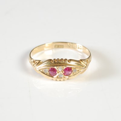 Lot 278 - An 18ct gold garnet and diamond chip dress...