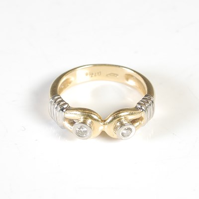 Lot 285 - An 18ct white and yellow gold two stone...
