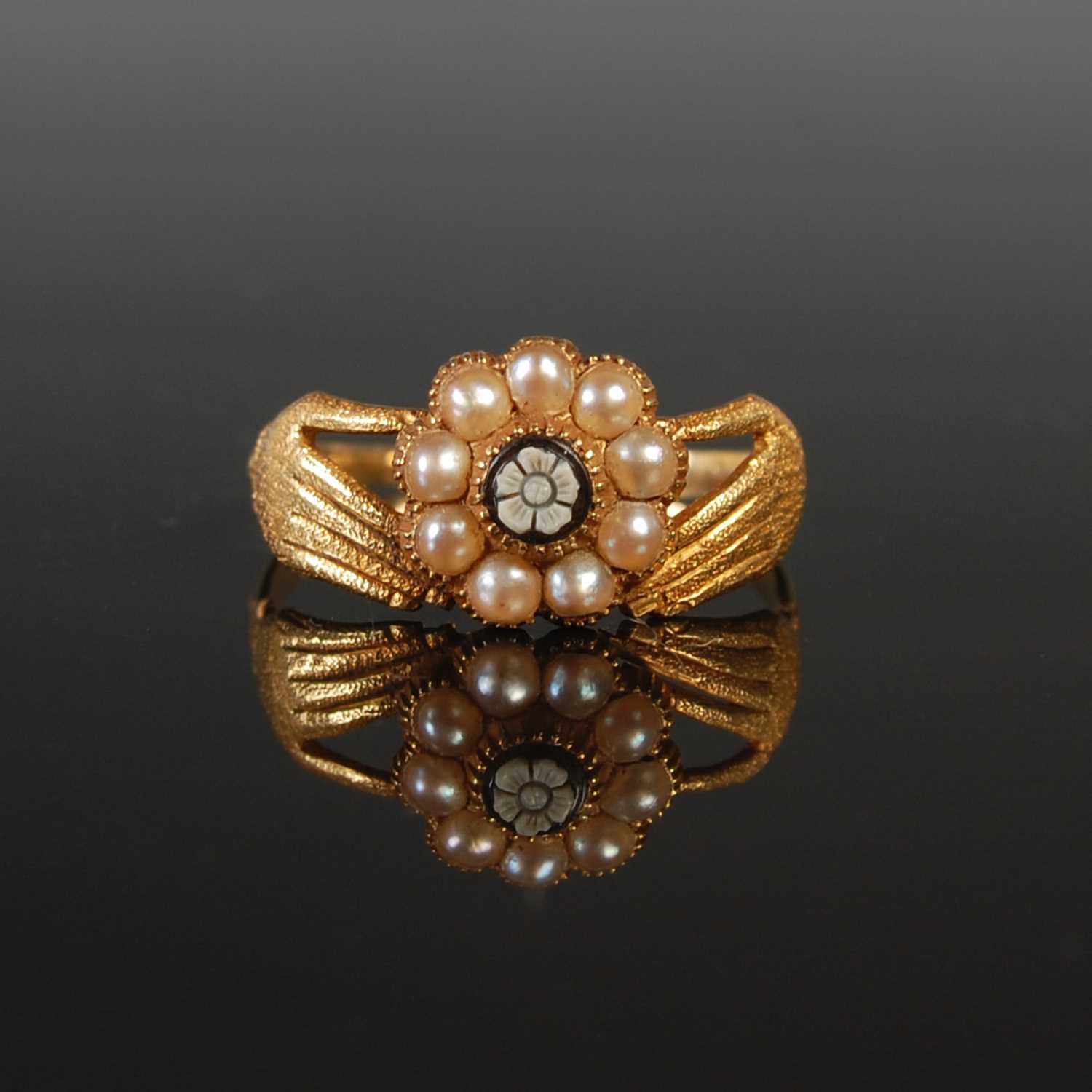 Lot 287 - A yellow metal split pearl and cameo carved...