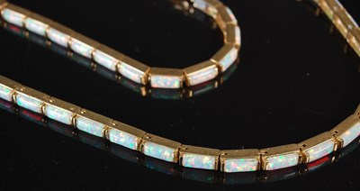 Lot 293 - A 14ct gold and opal articulated necklace;...
