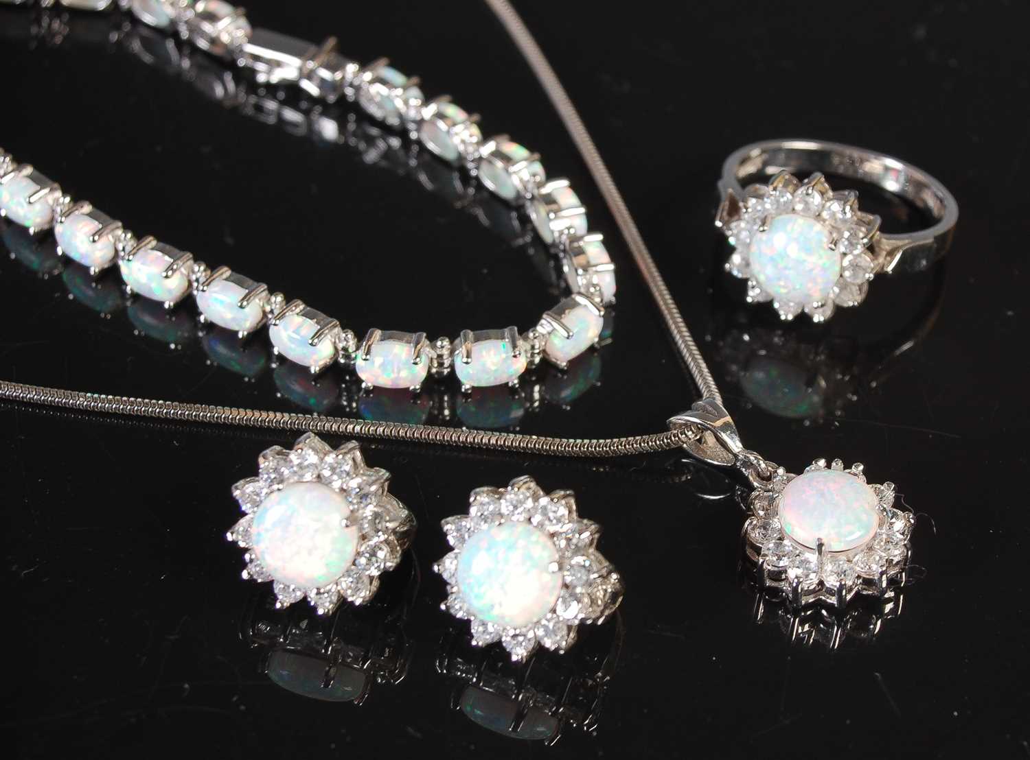 Lot 53 - A group of 14ct white gold and opal set...