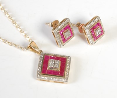 Lot 301 - A 9ct gold diamond and ruby set pendant...