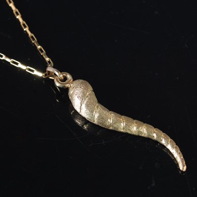 Lot 309 - A 9ct gold necklace suspending a 9ct gold...