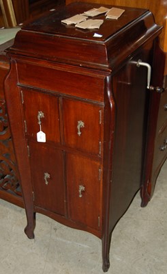 Lot 723 - A mahogany Fullotone music cabinet, the hinged...