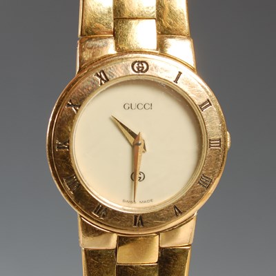 Lot 329 - A vintage Gucci ladies gold plated bracelet...