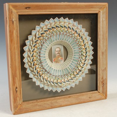 Lot 346 - A framed circular paper craft made from...