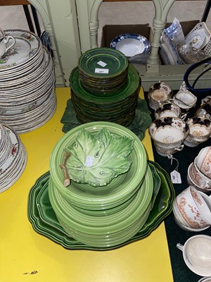 Lot 467 - A part green glazed ceramic dinner service.