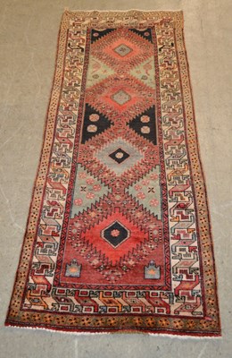 Lot 877 - A Persian Hamadan runner, the rectangular...