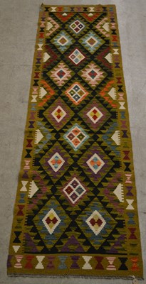 Lot 878 - A Maimana Kilim runner, the rectangular black...
