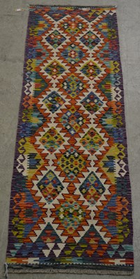 Lot 879 - A Chobi Kilim runner, the ivory coloured...