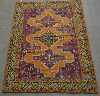 Lot 880 - A Kashmiri hand stitched rug, the purple...