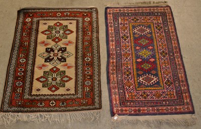 Lot 885 - Two small Persian rugs, to include one with an...