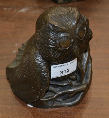 Lot 312 - A resin owl sculpture, signed to reverse...