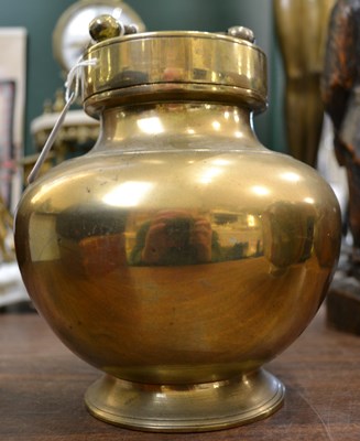 Lot 334 - An Indian brass holy water vessel of lobed...