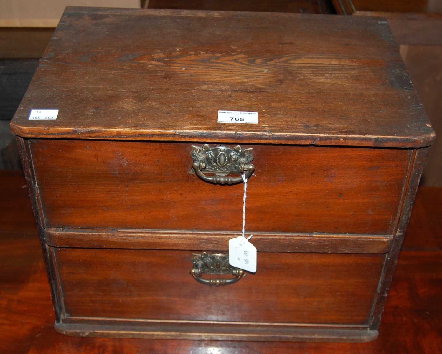 Lot 765 - A vintage stained pine two drawer table top chest