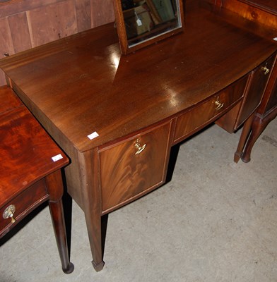 Lot 767 - A 20th century mahogany kneehole dressing...