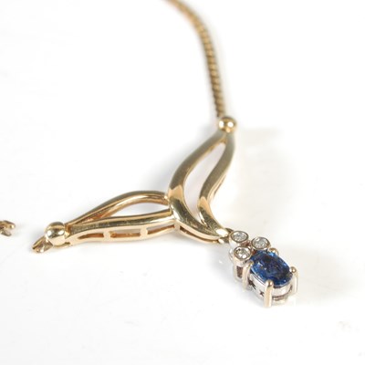 Lot 27 - A yellow metal sapphire and diamond set...