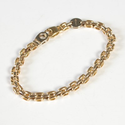 Lot 35 - An 18ct gold bracelet, inscribed on circular...