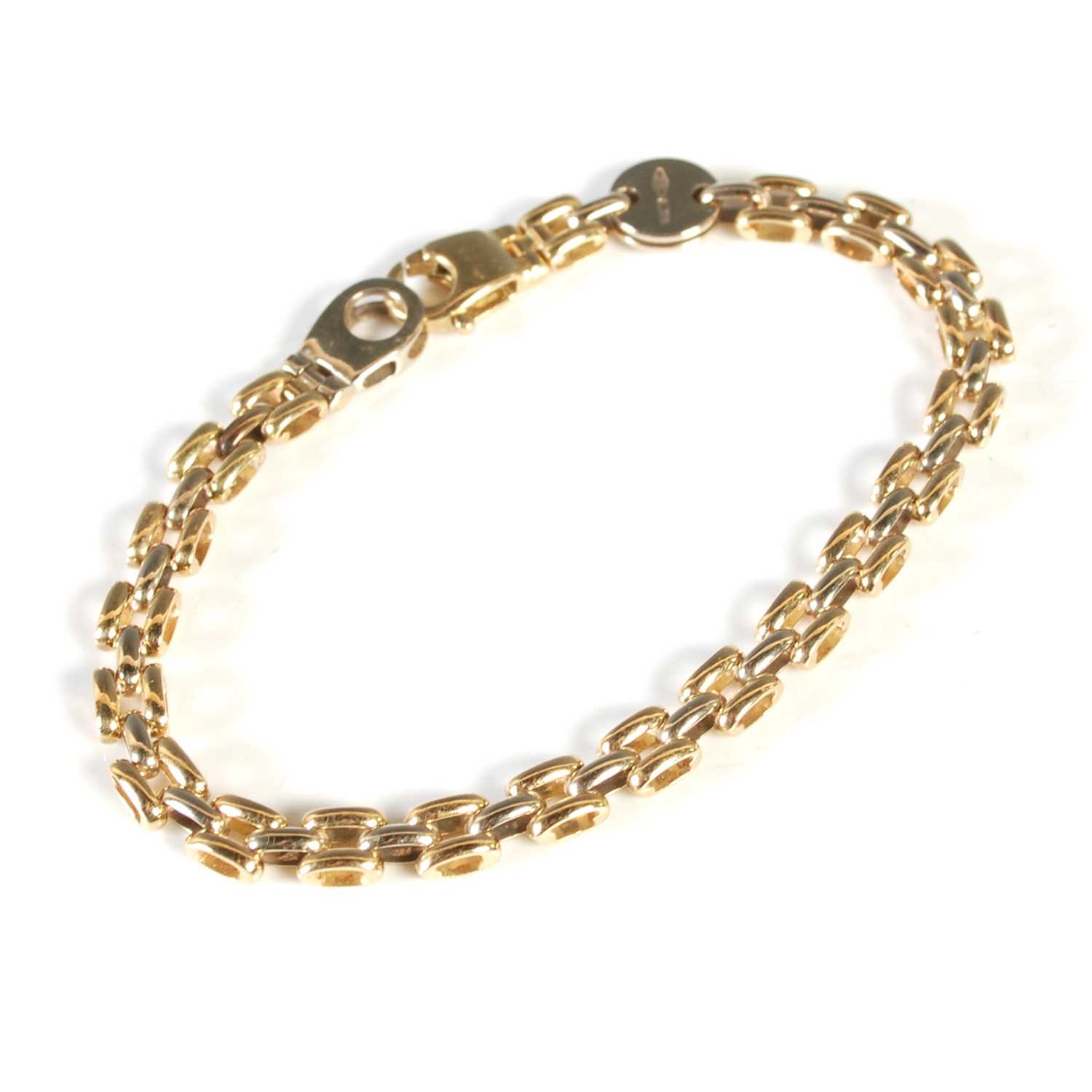 Lot 35 - An 18ct gold bracelet, inscribed on circular...