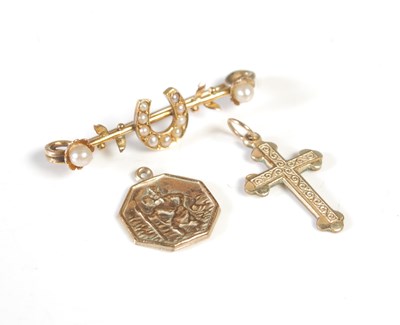 Lot 37 - A 9ct gold octagonal shaped Saint Christopher...