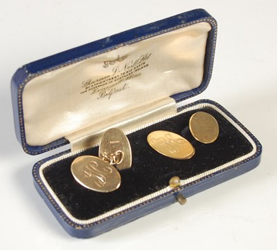 Lot 45 - A pair of 9ct gold oval cufflinks, each with a...