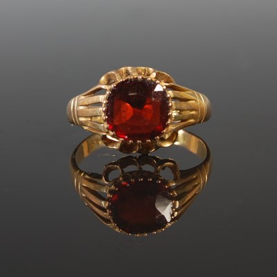 Lot 49 - A 9ct gold and garnet single stone ring, size...