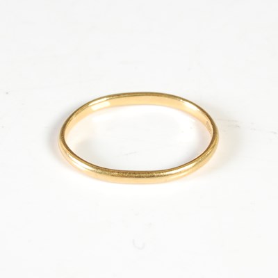Lot 51 - A 22ct gold wedding ring, slightly misshapen,...
