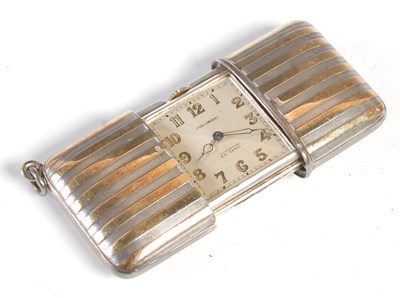 Lot 102 - A Continental silver cased Movado travelling...