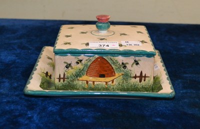 Lot 374 - A Wemyss Pottery honey box cover and stand,...