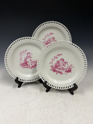 Lot 386 - A Minton part dinner service with puce printed...