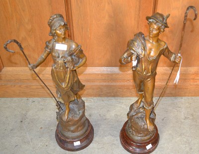 Lot 413 - A pair of bronzed spelter figures of male and...